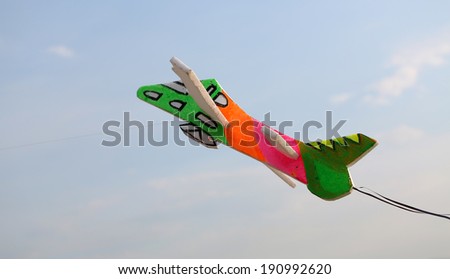 colorful toy plane on blue sky.