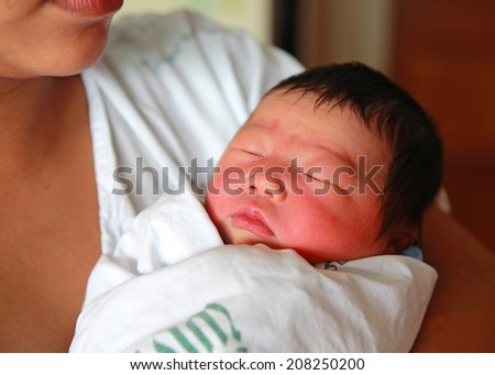 newborn infant Aged 2 Days sleep on mother\'s chest