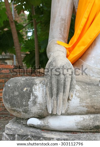 Close up hands of buddha statue