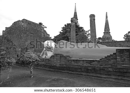 Big large white buddha sleep posture landmark in temple chaimongkol place of worship, Black and white