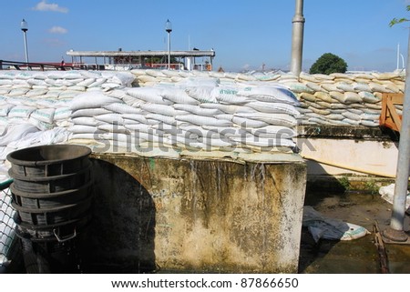 BANGKOK, THAILAND - OCTOBER 29: Sandbags are placed everywhere to prevent flooding after Water burst its banks on the Chao Phraya River to 2.5 m  on October 29, 2010 in Bangkok, Thailand.