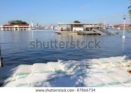 BANGKOK, THAILAND - OCTOBER 29 : Sandbags are placed to prevent flooding after Water burst its banks on the Chao Phraya River to 2.5 m  on October 29, 2010 in Bangkok, Thailand.