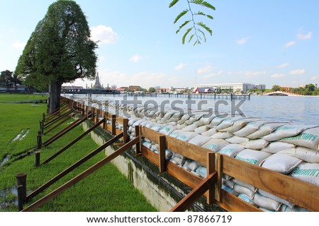 BANGKOK, THAILAND - OCTOBER 29 : Sandbags are placed to prevent flooding after Water burst its banks on the Chao Phraya River to 2.5 m on October 29, 2010 in Bangkok, Thailand.
