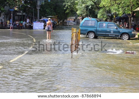 BANGKOK,THAILAND - OCTOBER 29 : Flood waters run through the streets of the city during the worst monsoon flood on October 29, 2011 in Bangkok, Thailand.