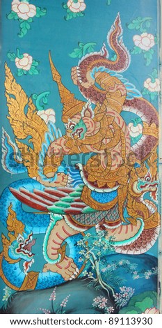 Masterpiece of traditional Thai style painting art old about Hanuman fight king of naga story on the wall of Sutat Temple, Bangkok,Thailand