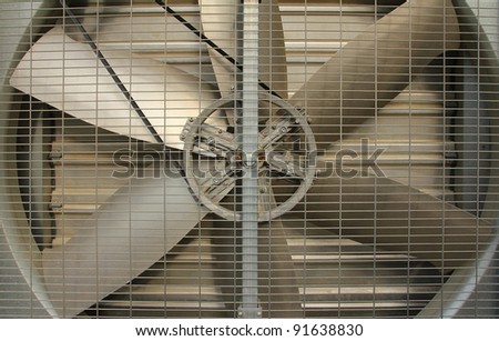 A turbine behind silver bars