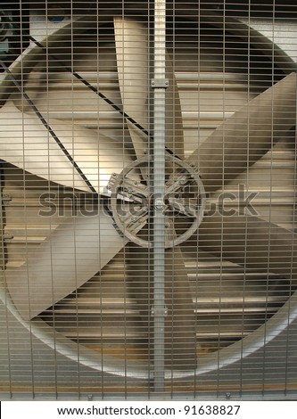 A turbine behind silver bars