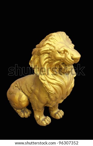 Golden lion statues isolated on black background.