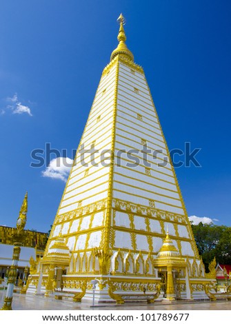 Ornament: white and gold pagoda entrance at wat Phrathat Nong Bua in Ubon Ratchathani province, Thailand
