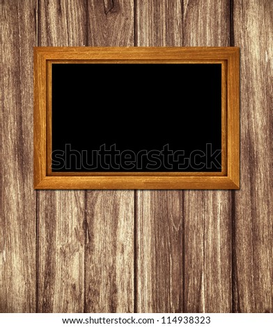 Vintage wooden frame on wood background