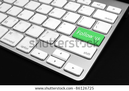 Follow us on social network concept - computer keyboard with fol