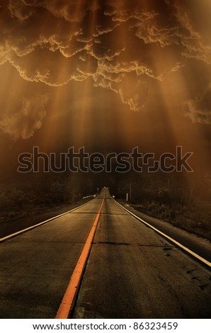 road and dark thunder clouds over it
