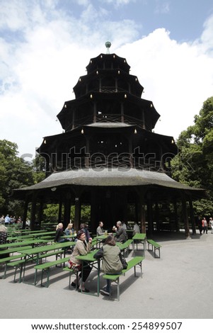 MUNICH, GERMANY - JUNE 28, 2013: Beer Garden at the English Garden in Munich. The English garden with his beer garden is very popular by local people and tourists.