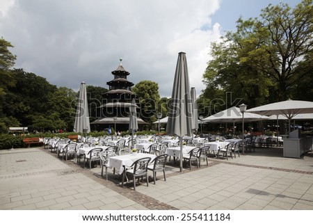 MUNICH, GERMANY - JUNE 28, 2013: Restuarant at the English Garden in Munich. The English garden with his restaurant and beer garden is very popular by local people and tourists.