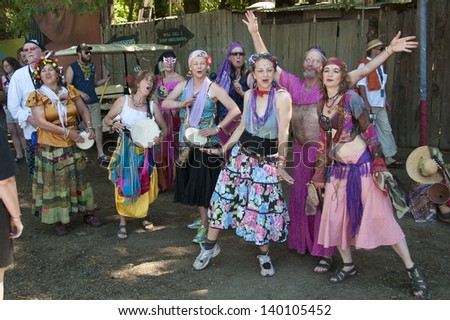 VENETA, OREGON - JULY 11, 2010: A group of singing dancers greet visitors to the Oregon Country Fair outside of Eugene, Oregon July 11, 2010. Their outrageous clothing and sense of fun typifies this annual event.