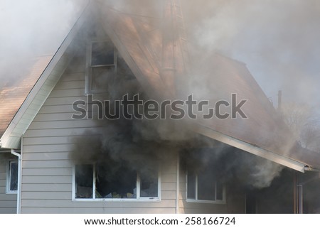 Thick smoke engulfs a home, foreshadowing the blazing destruction to come.