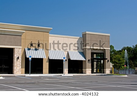 newly constructed commercial mall with stone accents on front faces