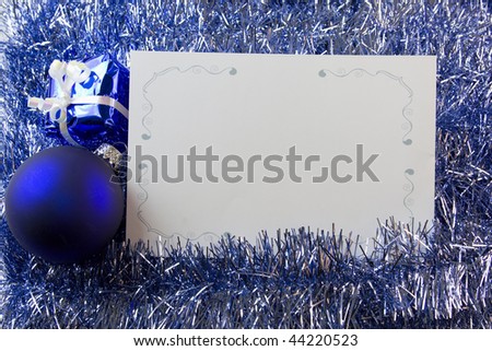 blank Christmas greeting card with blue ornaments and copyspace