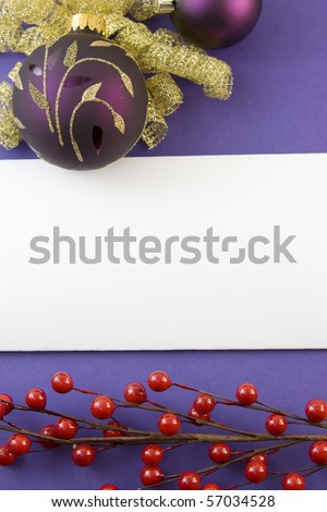 blank Christmas card with gold scroll purple bauble, bow, red berries, and copyspace