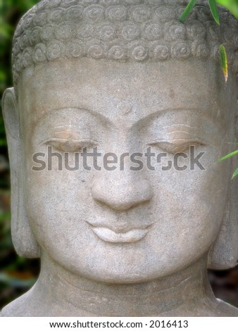 Old (18th C) stone sculpture depicting face of Buddha. This big, peaceful face is very comforting.
