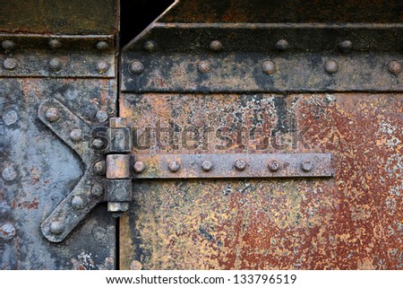 Rusty steel door and door hinges