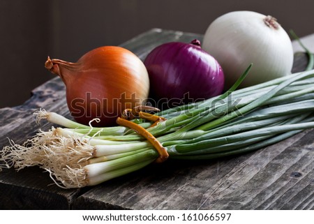 Different Onions On Wood