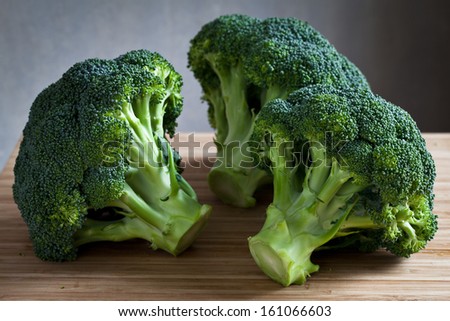 green broccoli on wooden board