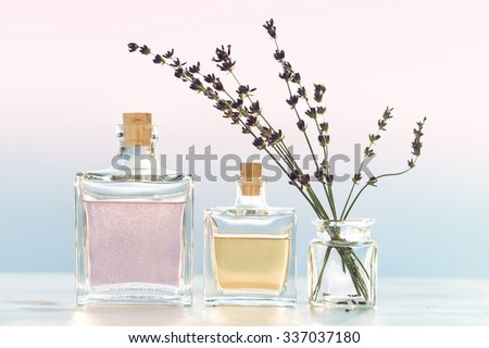 Glass bottles with cosmetic  on evening sea view