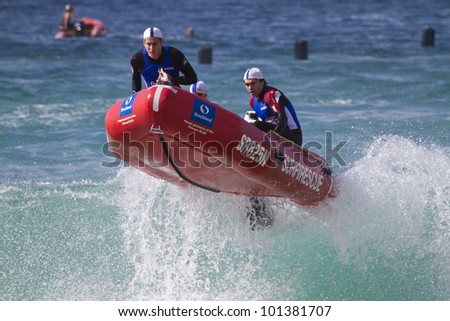 MOLLYMOOK, NSW, AUSTRALIA - APRIL 28 - Thirroul Surf Life Saving Club competing at Round One of the NSW IRB Premiership hosted by Mollymook Surf Club at Mollymook Beach on the 28th of April 2012.