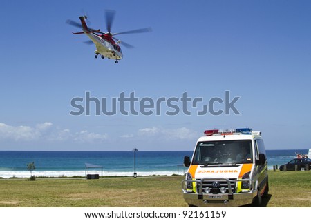 MOLLYMOOK, NSW, AUSTRALIA - CIRCA DEC. 2011:Ambulance helicopter departing Mollymook Beach on December 30, 2011 after being called in to treat a spinal injury.