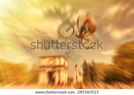 Abstract background . Boy on a BMX mountain bike jumping. Motion blur photo. Competition in Kishinev, Moldova central square.
