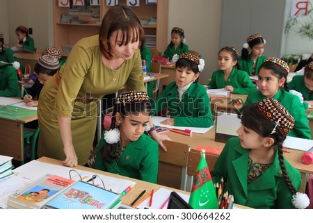 Ashgabad, Turkmenistan - November 4, 2014. Group of students with the teacher in a lesson.