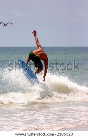 Skimboard on wave on Florida\'s Gulf Coast
