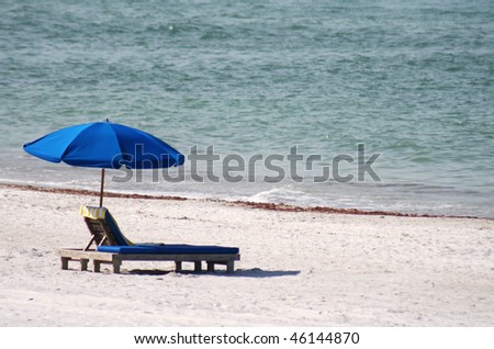 Blue Chair and umbrella on Florida Gulf Coast. Madeira Beach Florida