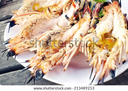 Big prawn on dish with spicy sauce