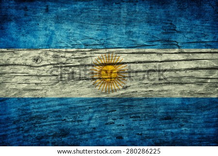 Vintage flag of Argentina on wooden surface