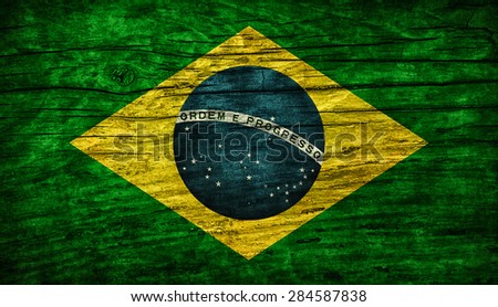 National vintage flag of Brazil on wooden surface