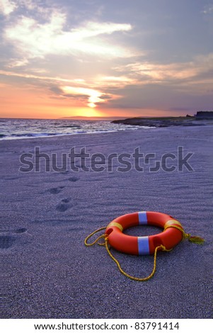 Ring buoy lying on the sandy beach