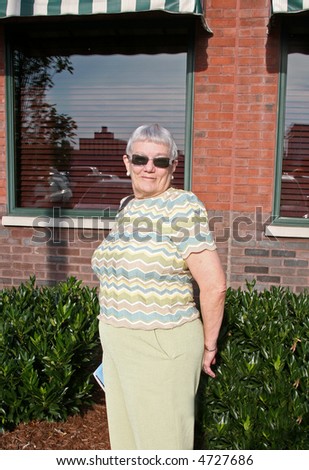 Woman posing outside a restaurant