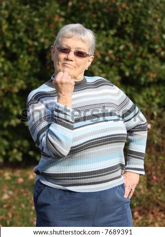 Elderly woman shaking her fist