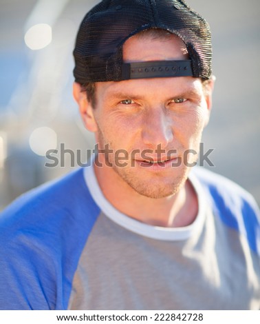 Man in a trucker cap. Outdoor shoot