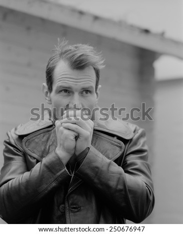 Pensive guy portrait. Trench coat. Outdoor shoot