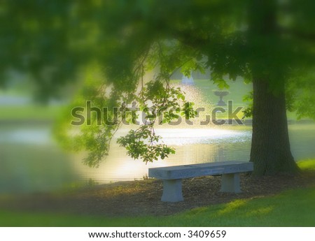 dreamy mist and stone bench by cemetery lake