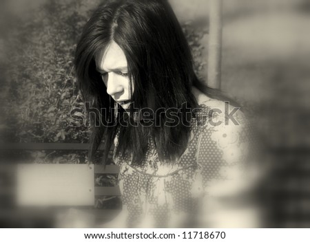 sad teenage girl black and white blur background