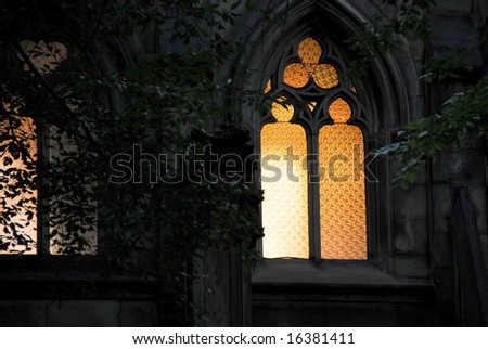 eerie light from the cemetery,mausoleum window at dawn