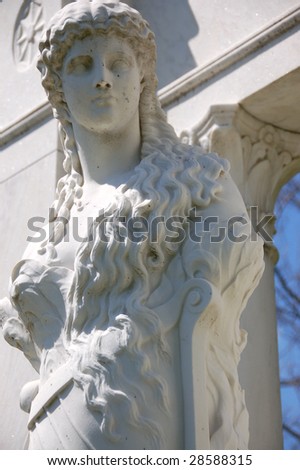 white marble statue Greek woman grave marker