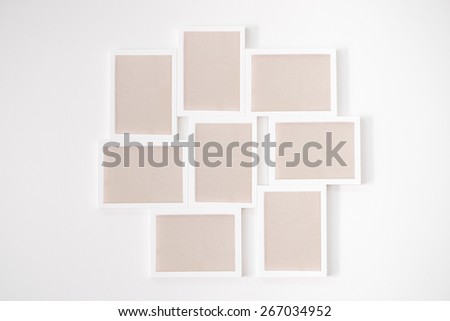 8 white wooden frame on white wall