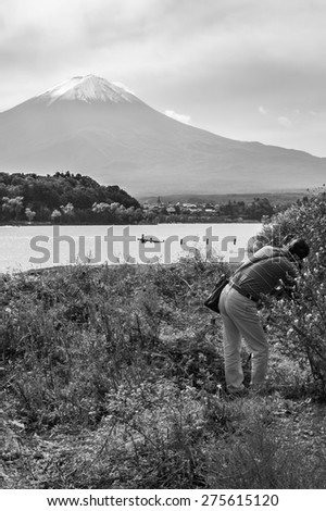 Kawaguchiko, Japan - September 27, 2014: People take a photo mountain Fuji from kawakuchiko lake, Japan.