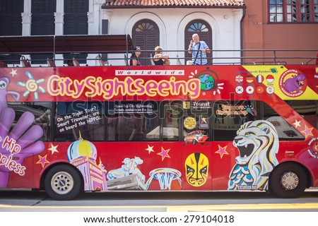 Singapore, Singapore - May 10, 2014: Tourist on the bus for travel around the city, Singapore.