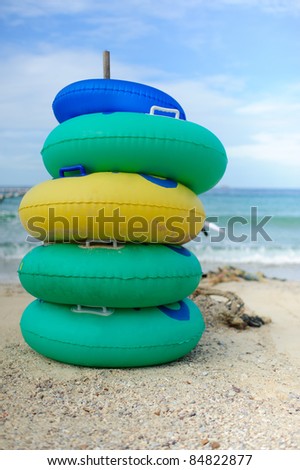 colorful rubber ring on the beach and blue sky